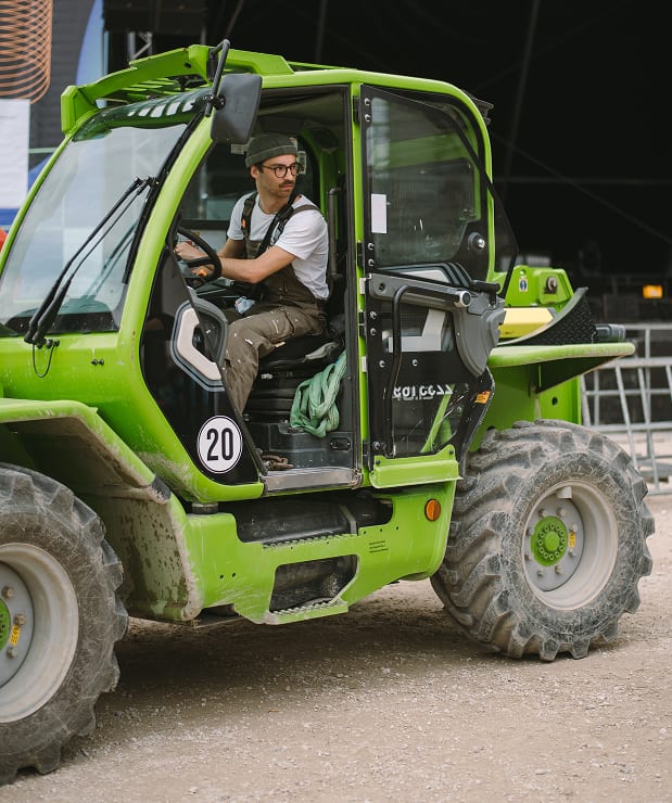 Driving a green forklift